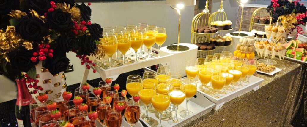 Edit7-resized Luxurious catering setup at Heritage 1907, Ram Mill in Oldham, featuring vibrant drinks, desserts, and elegant floral decor for events