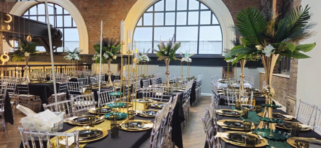 Long dining tables beneath the arched windows of Heritage 1907