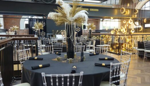 Exciting party at Heritage 1907, Ram Mill in Oldham, with dynamic lighting, industrial decor, and guests enjoying a lively celebration.