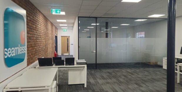 Characterful office space in Oldham at Ram Mill Business Centre, featuring exposed brick walls, natural light, cosy seating areas, and a kitchenette for a comfortable work environment