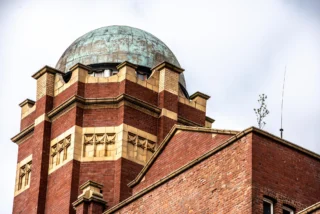 Standing high above Oldham since 1907, these towers were built as part of the original Ram Mill — one of the last cotton spinning mills constructed in the area before the industry began to decline. The towers served a practical purpose: water storage for the mill’s internal systems, including its fire sprinkler network. The dome on the south tower held a cast iron tank, and the height helped maintain pressure throughout the building. But function didn’t come at the expense of design. The detailed brickwork, stone banding and terracotta accents reflect the kind of ambition and pride that defined Oldham’s industrial boom. More than a century later, the towers still define our skyline. 📍 Ram Mill Business Centre, Oldham 📞 0161 470 6999 | ✉️ info@rammill.co.uk 🌐 www.rammill.co.uk #rammill #heritage1907 #oldhamhistory #watertower #milltown #industrialarchitecture #historicrenovation #penthouseconversion #manchesterproperty #brickwork #oldhamheritage #skylineview #historicbuildings #loveoldham #restorationproject #designinprogress
